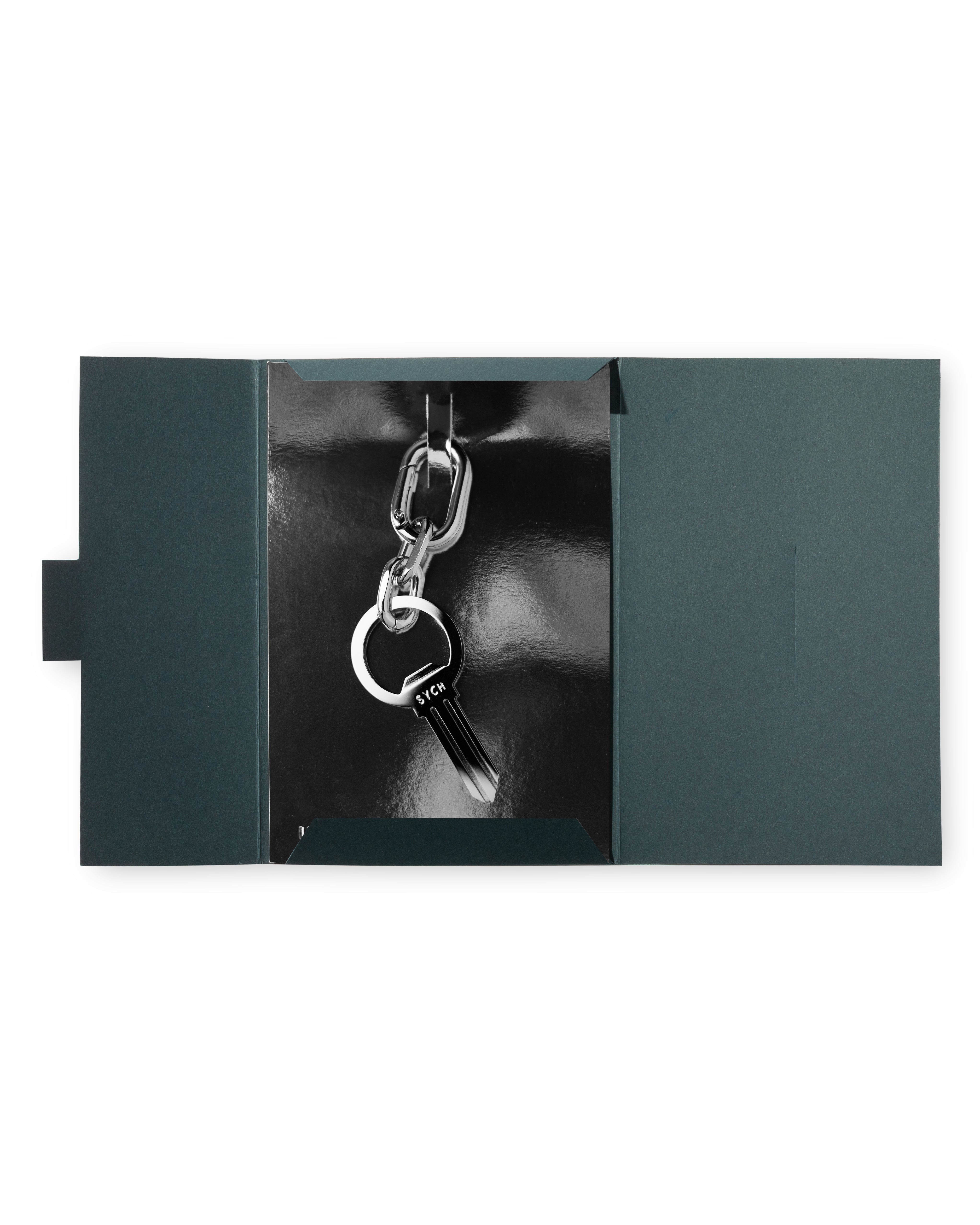 Silver bottle opener keyring in the shape of a key with a chain